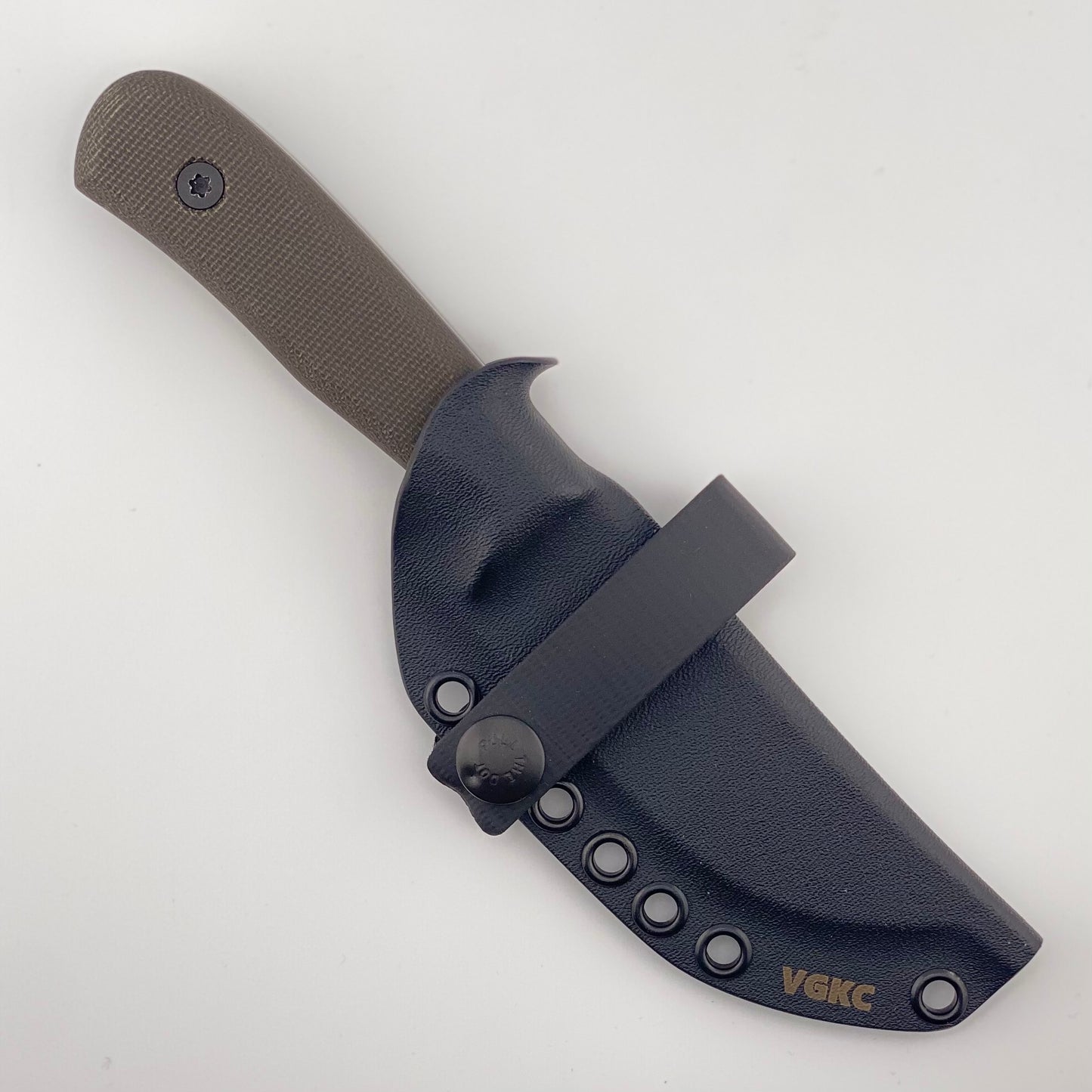 Dark green handled knife in a black sheath on a white background