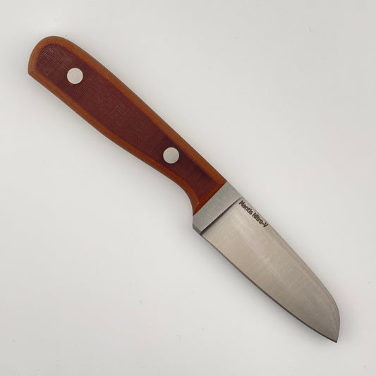 Knife with a vintage linen micarta handle on a white background