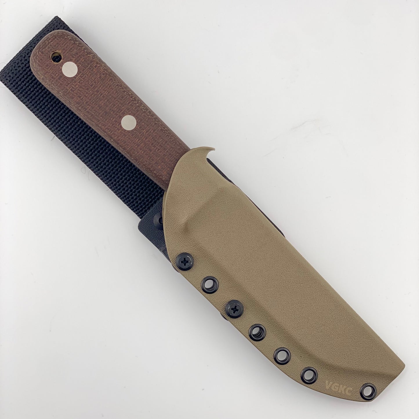 Fixed blade knife with brown burlap handles in a tan sheath on a white background