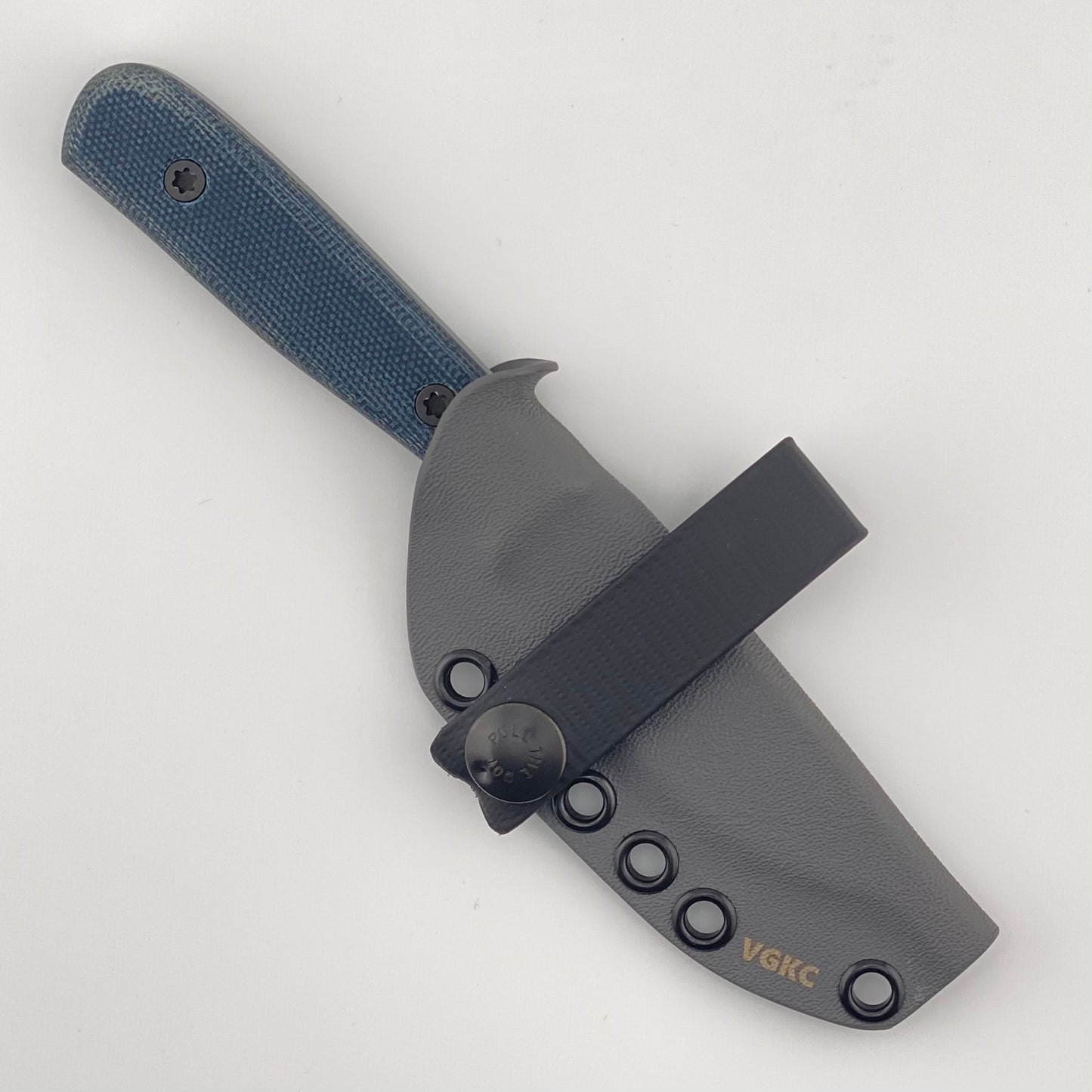 Fixed blade knife with denim blue handles in a gray sheath on a white background