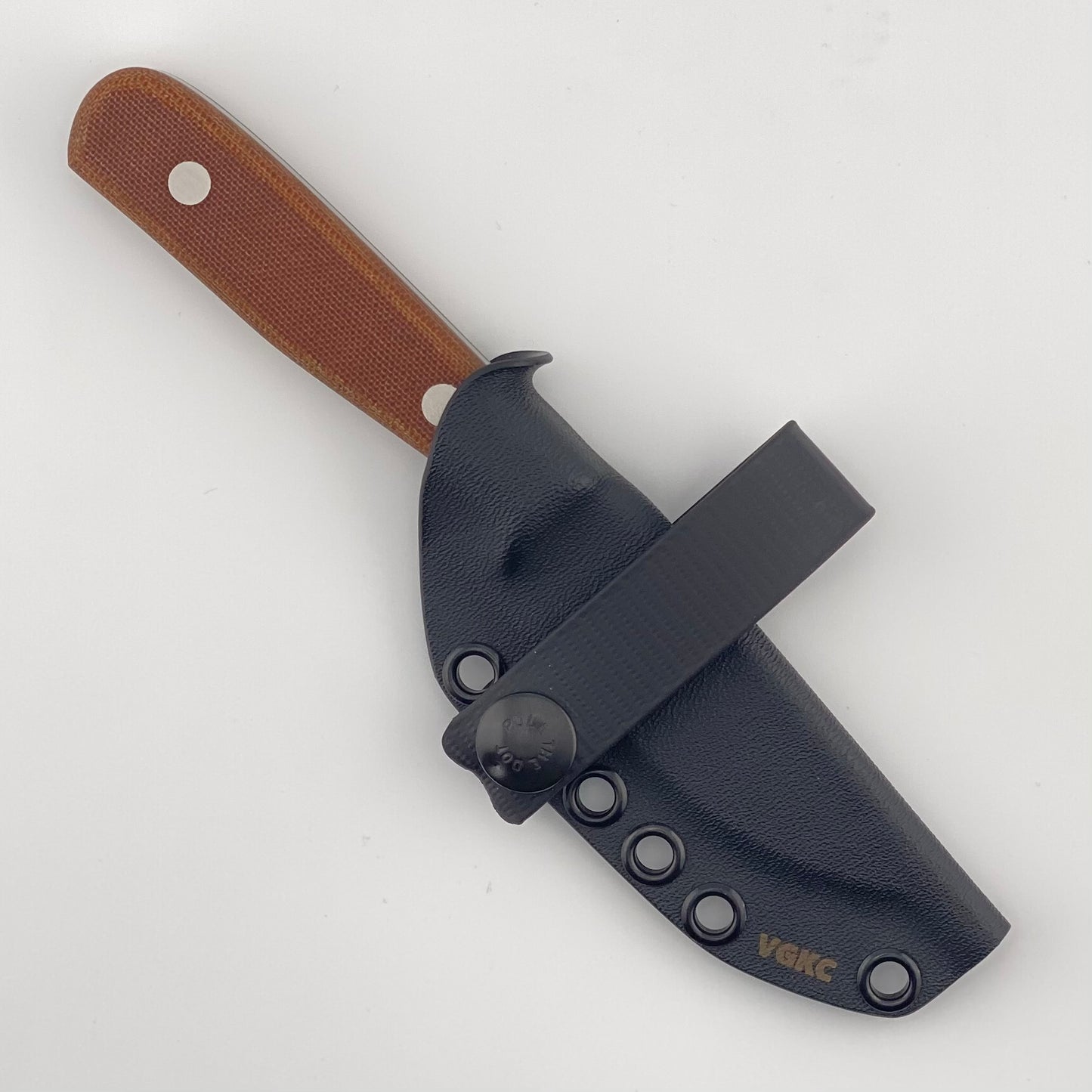 Fixed blade knife with brown handles in a black sheath on a white background
