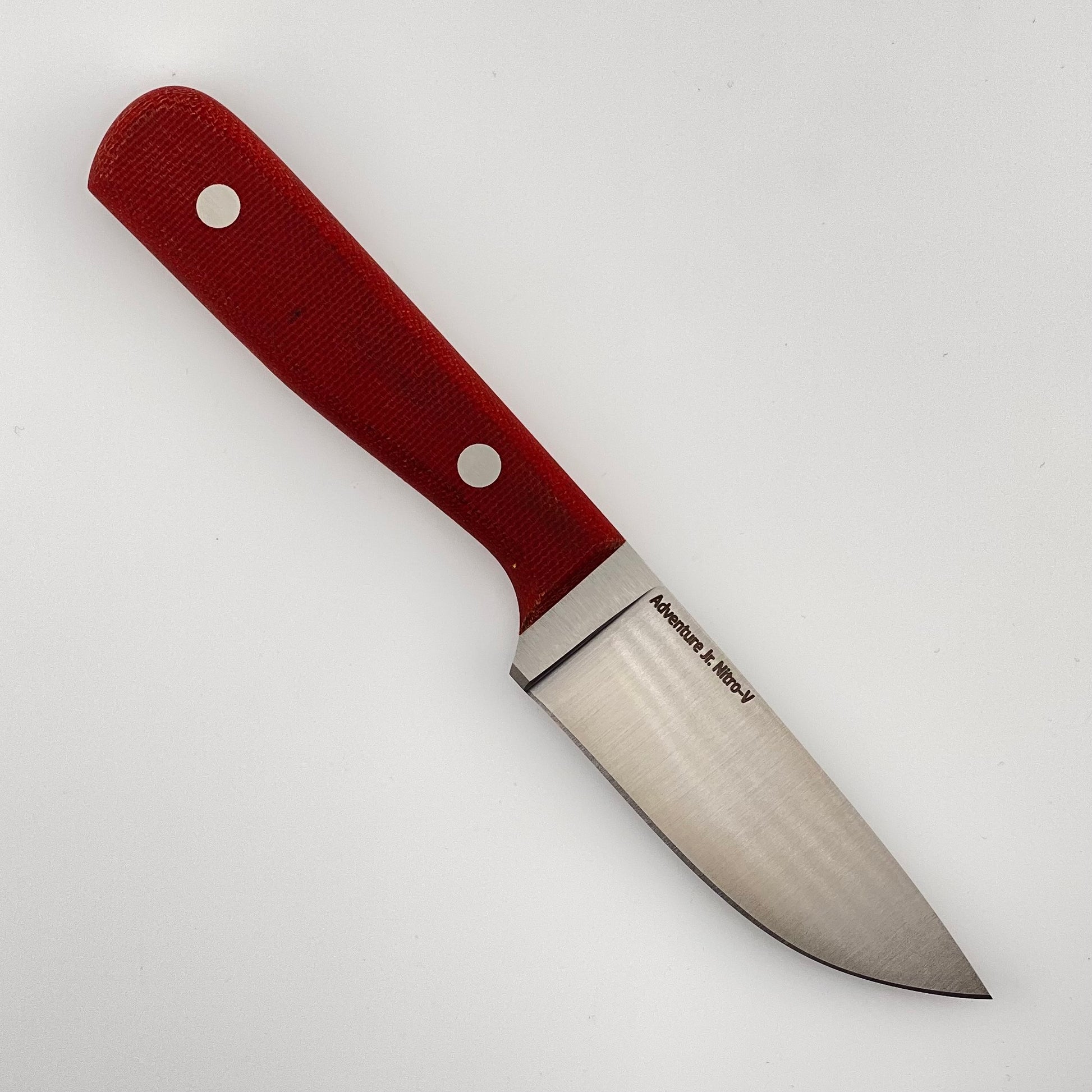 Knife with a red handle on a white background