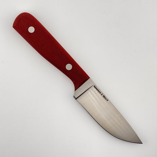 Knife with a red handle on a white background