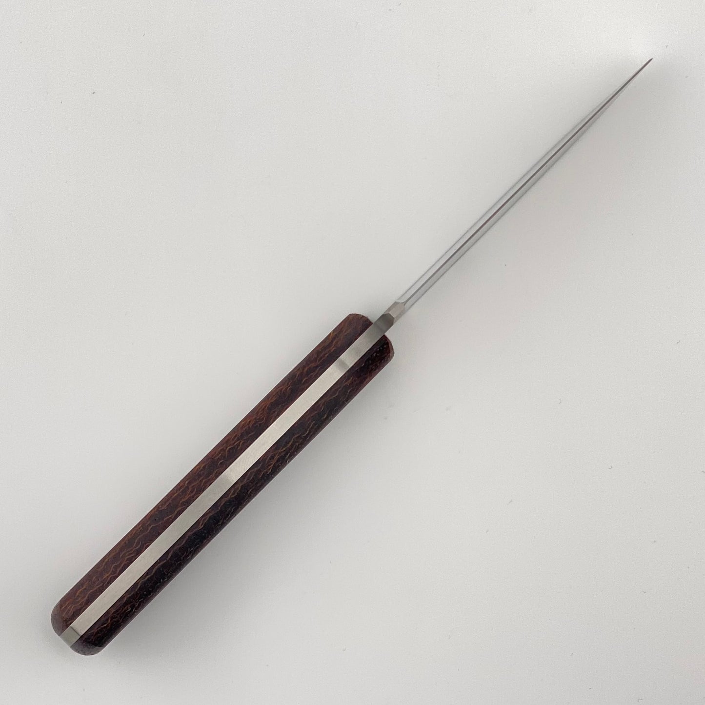 Knife with brown handle and full tang on a white background