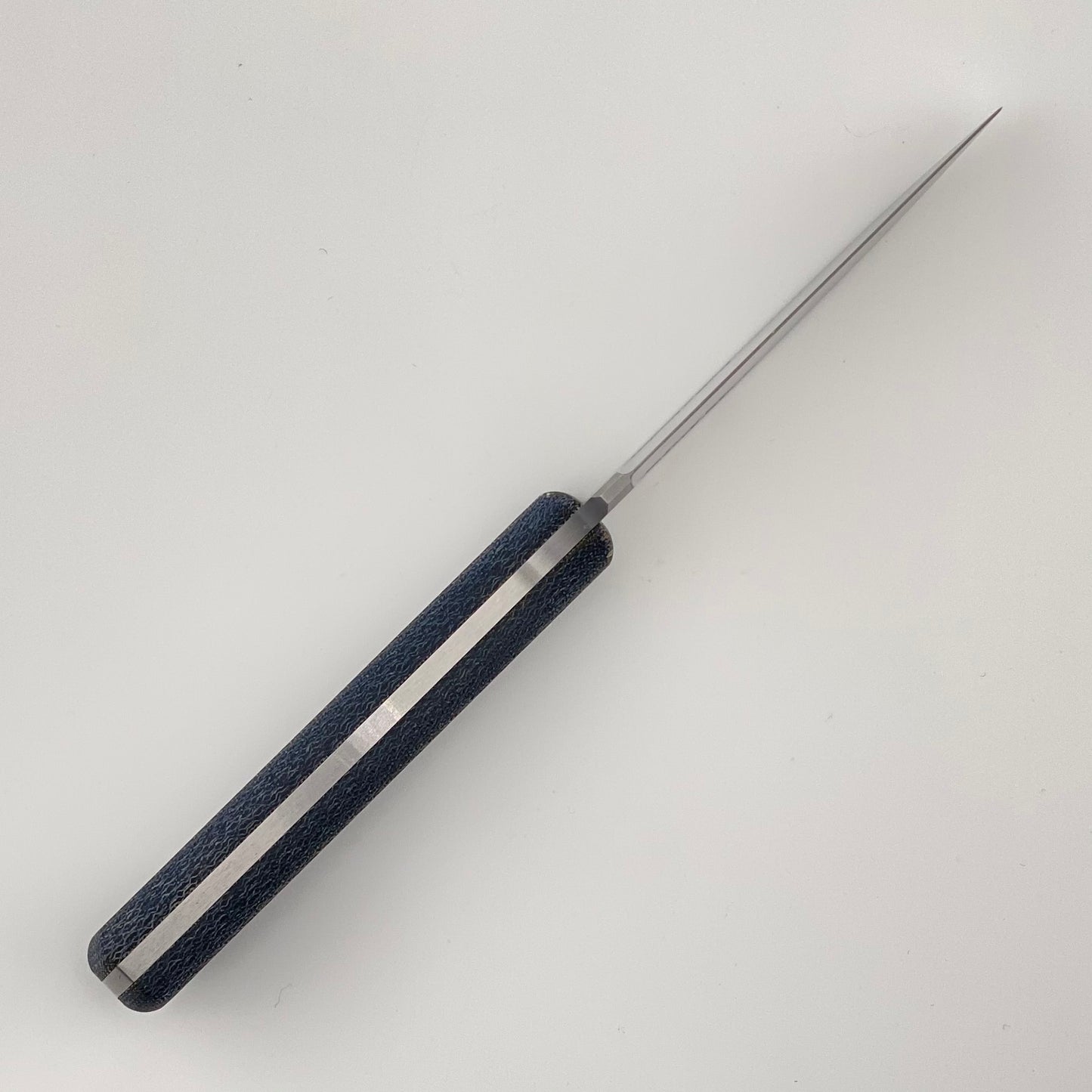 Knife with a denim blue handle on a white background