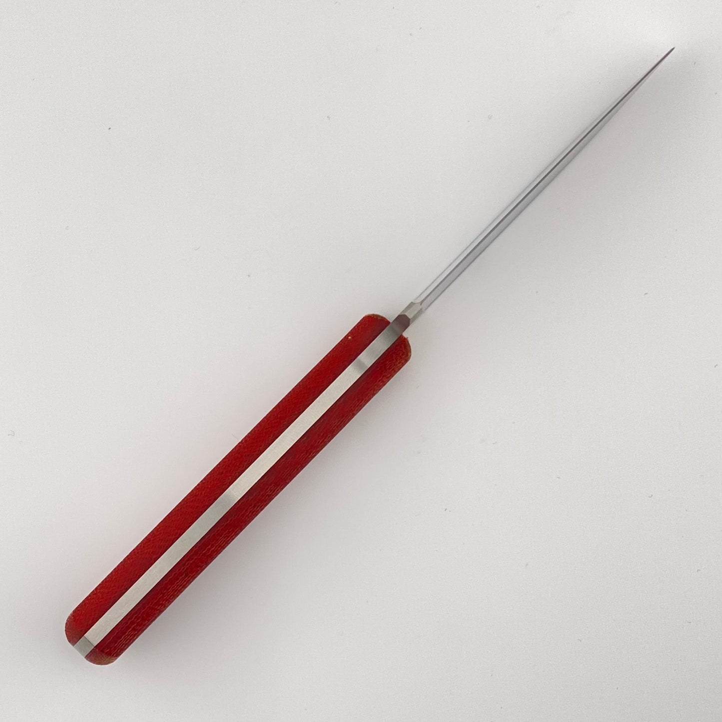 Red-handled knife on a white background