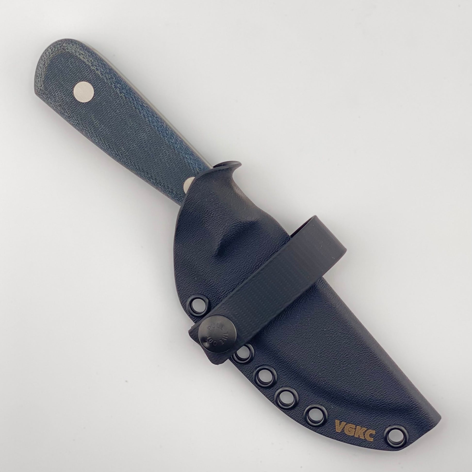 Denim blue handled knife in a black sheath on a white background