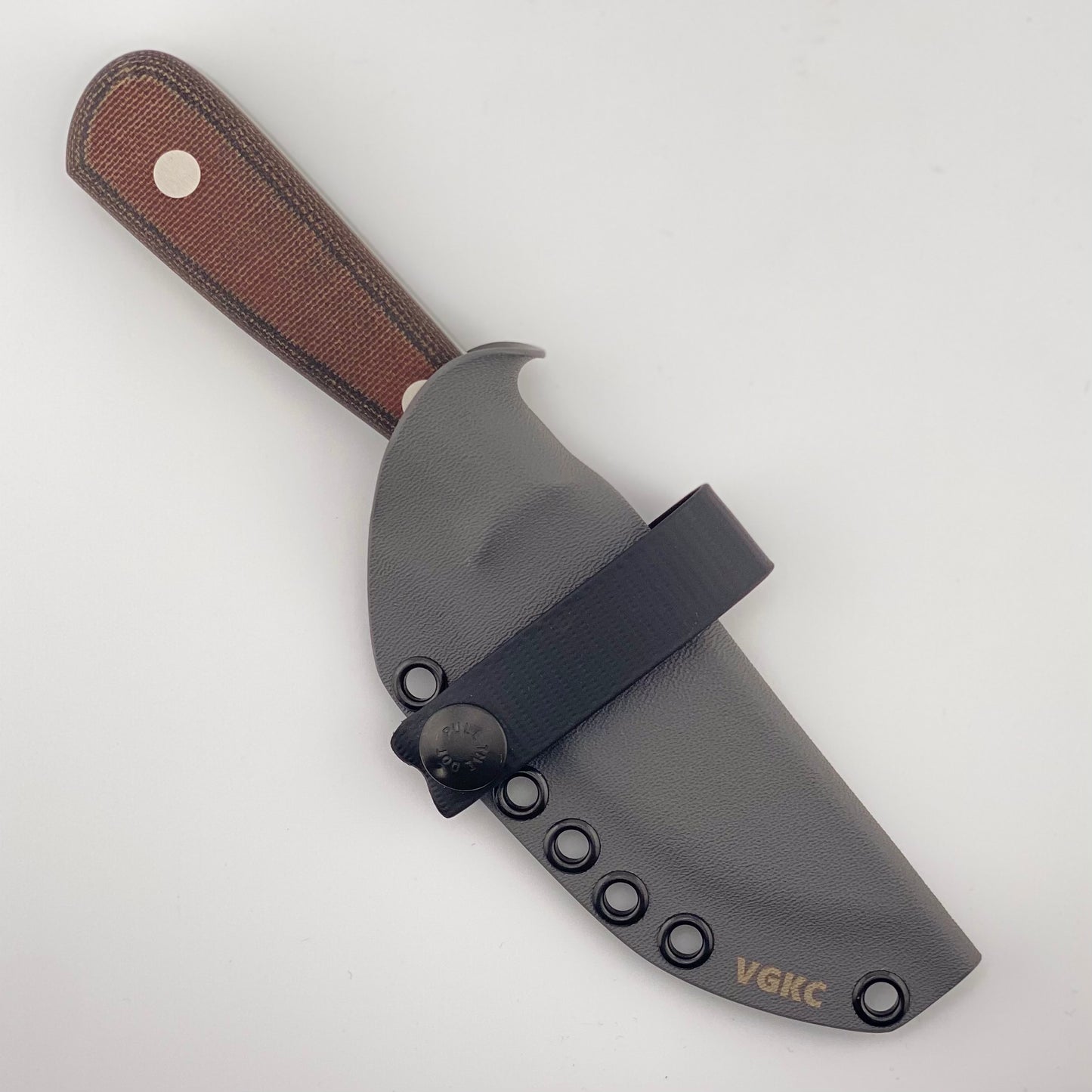 Knife with orange and black handle and black sheath on a white background