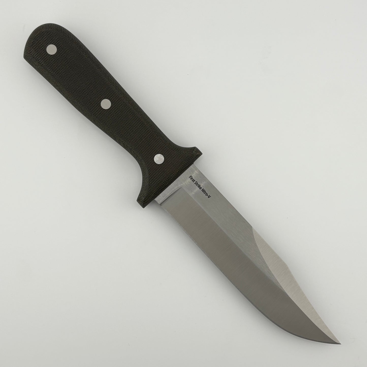 Knife with a dark green handle on a light gray background
