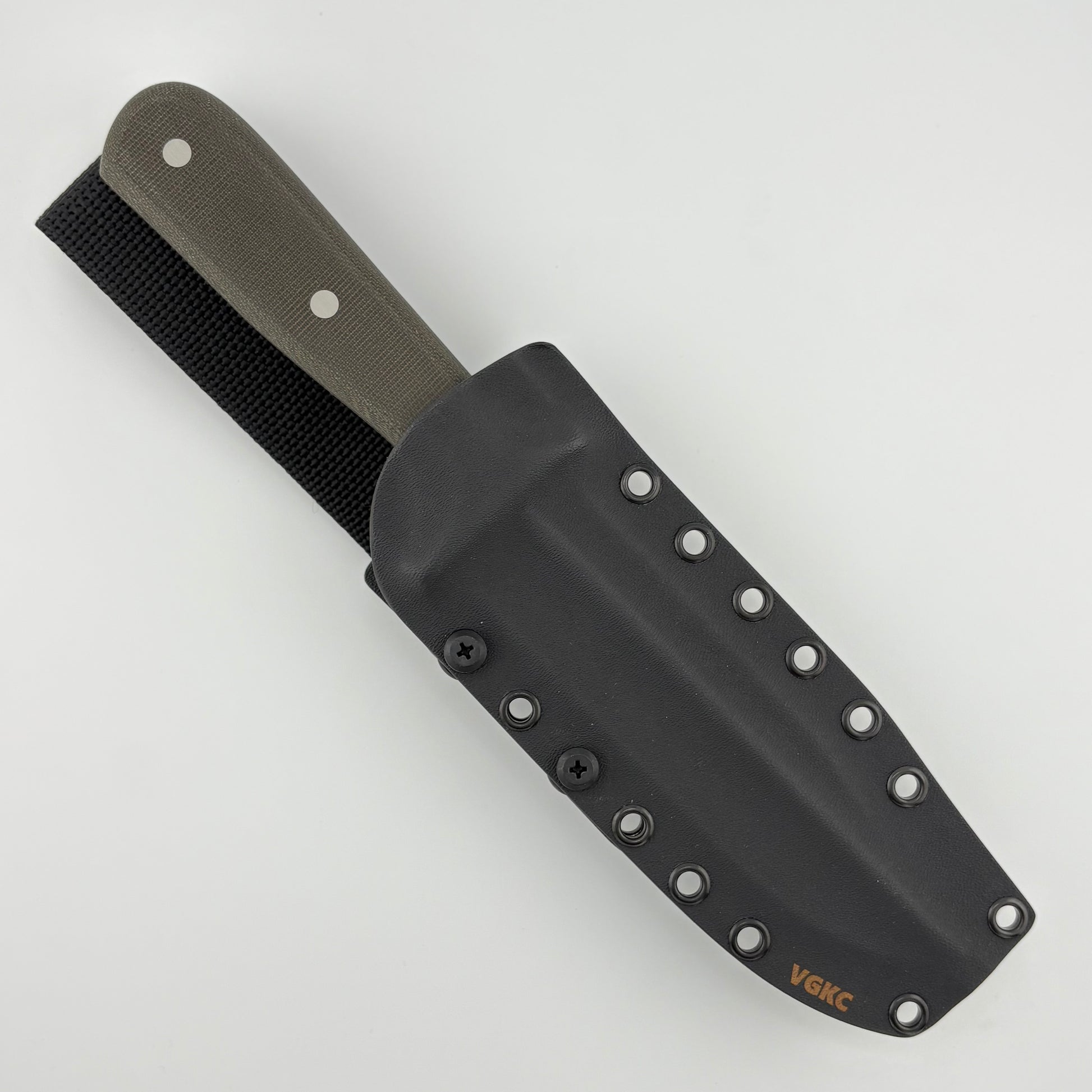 Knife with a dark green handle in a black sheath on a white background