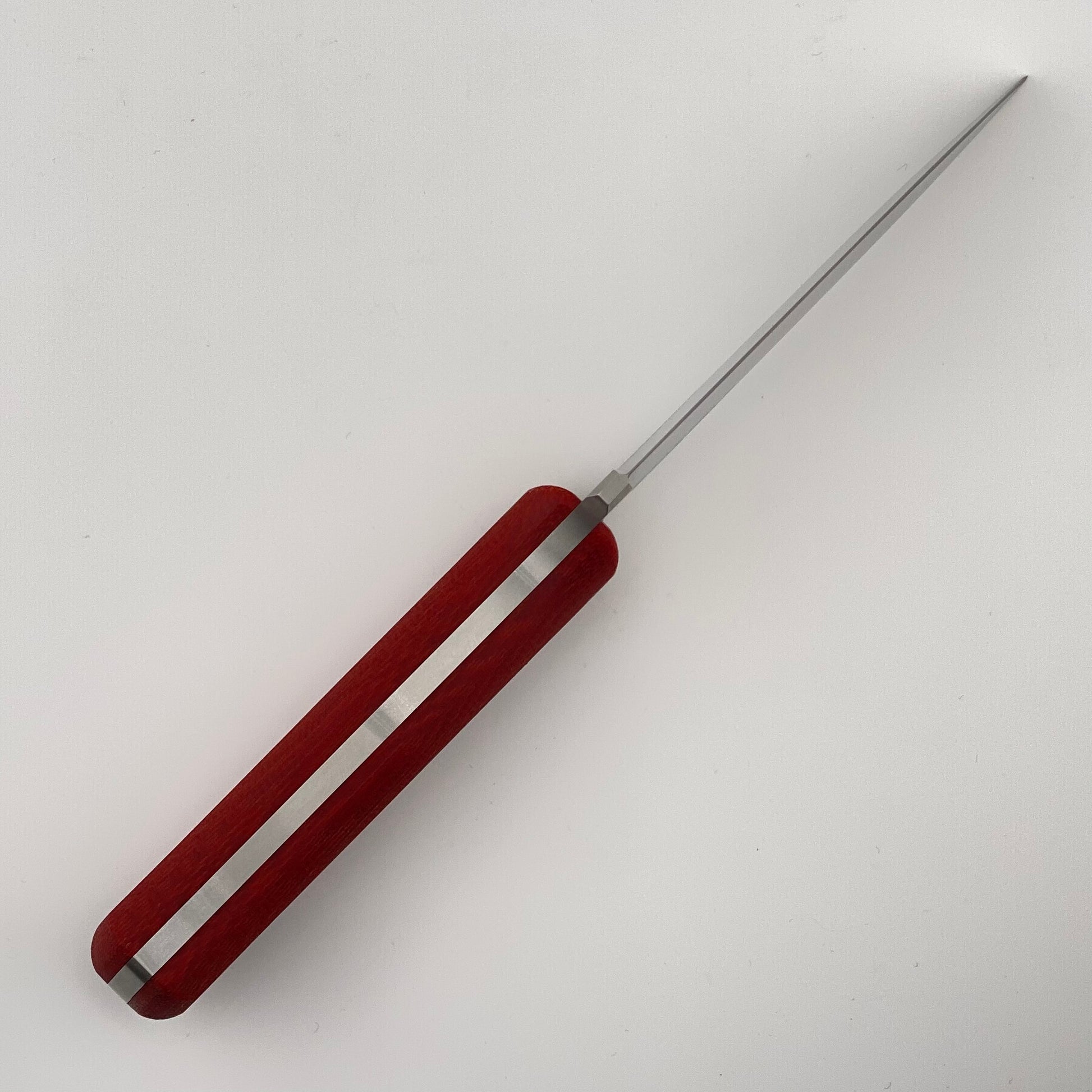 Red-handled knife on a white background