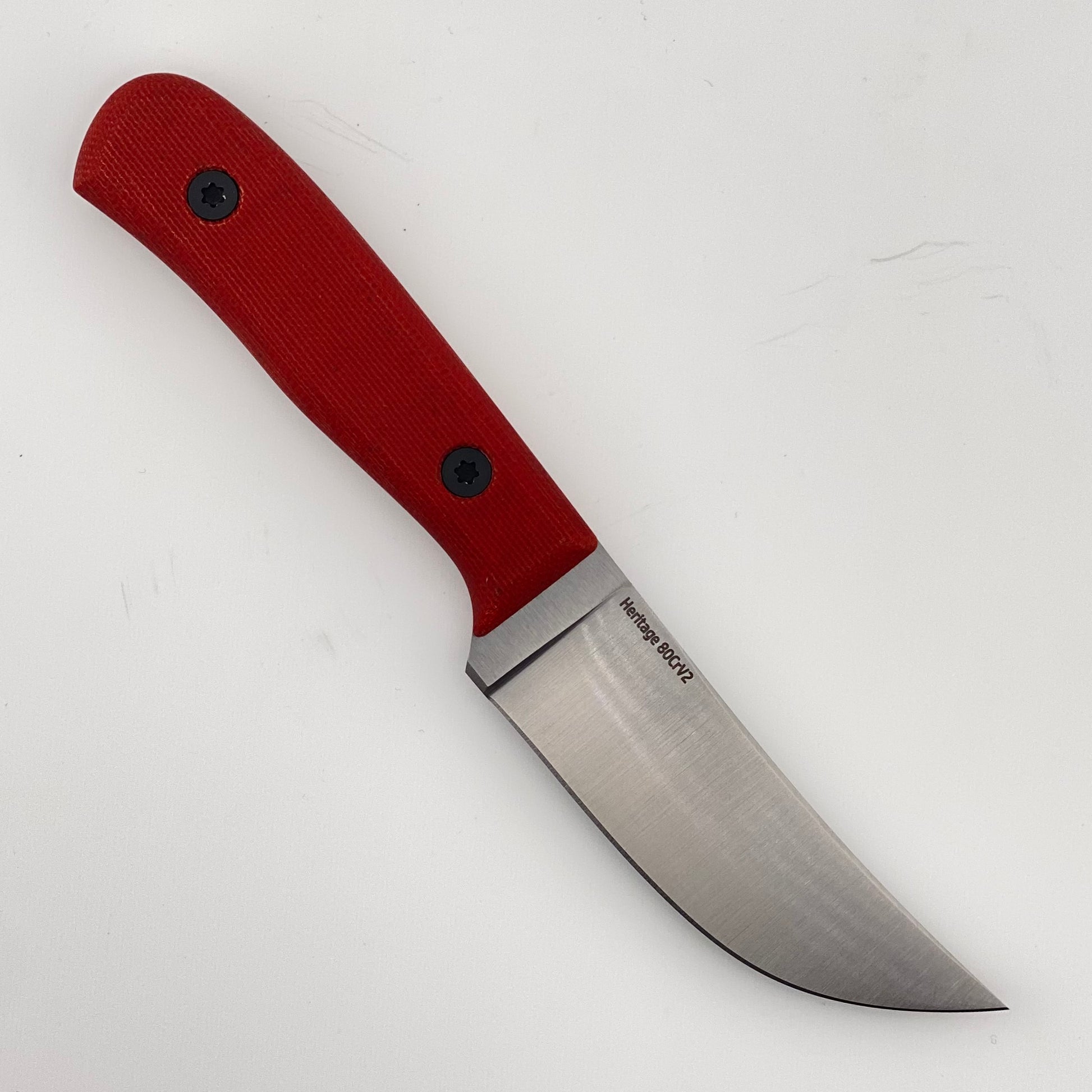 Fixed blade knife with red handles on a white background