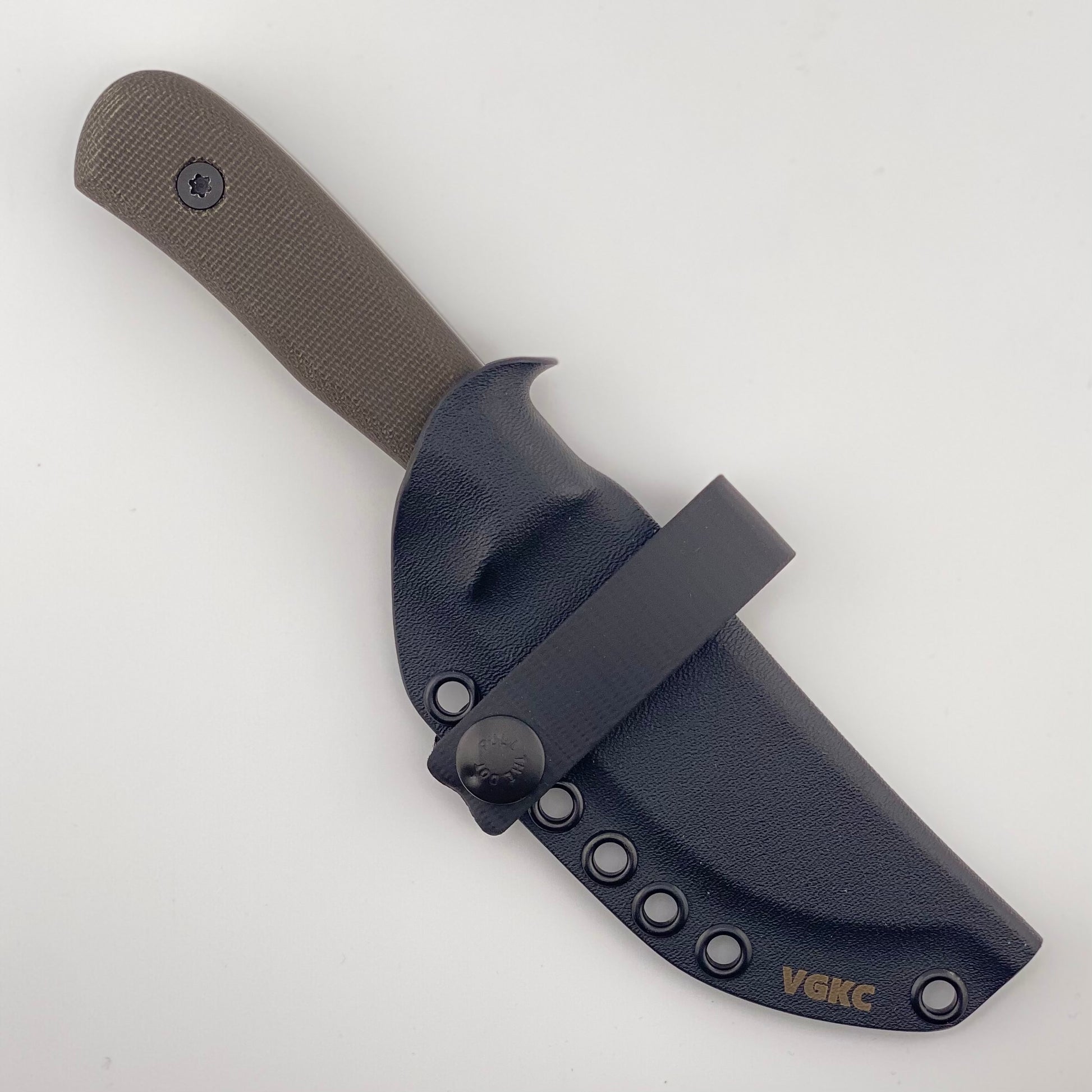 Dark green handled knife in a black sheath on a white background
