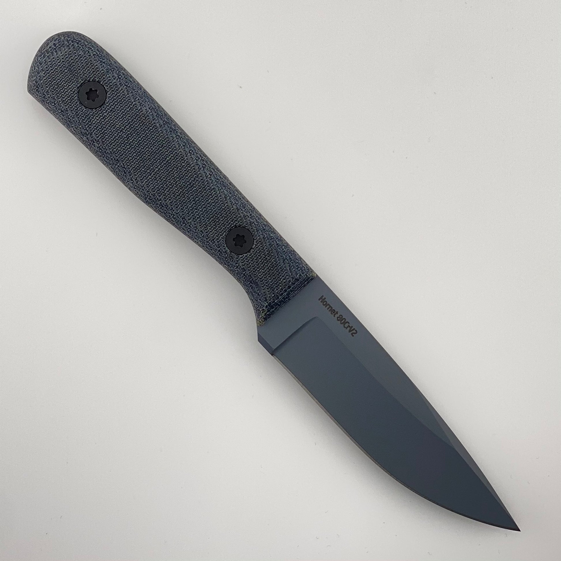 Gray fixed blade knife with denim blue handles on a white background