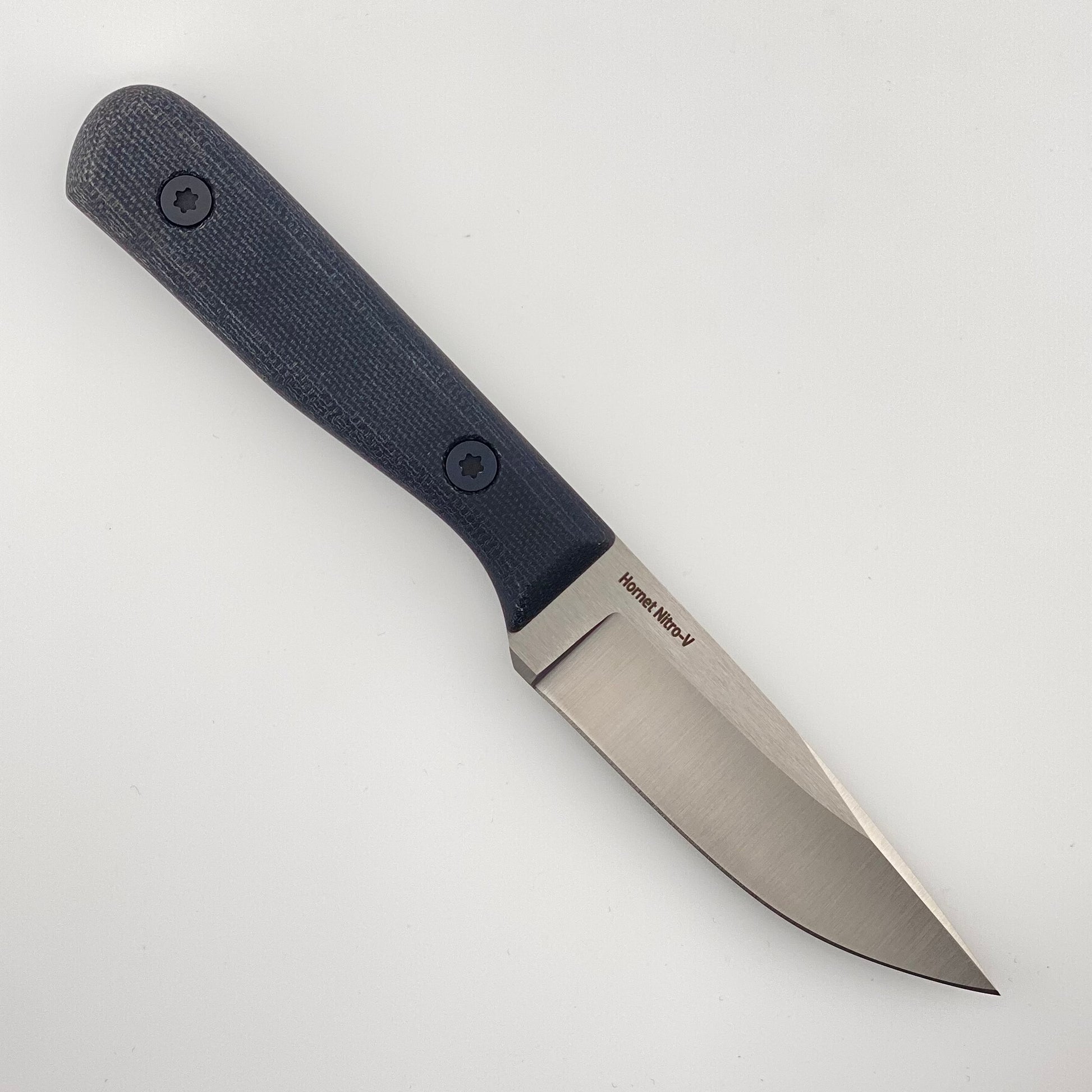 Fixed blade knife with a black handle on a white background