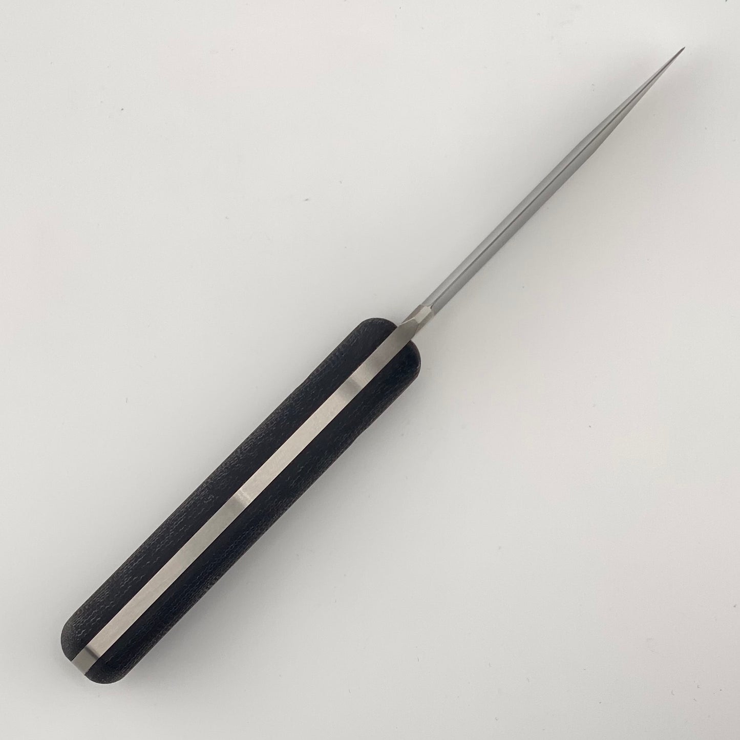 Fixed blade knife with black handles on a white background
