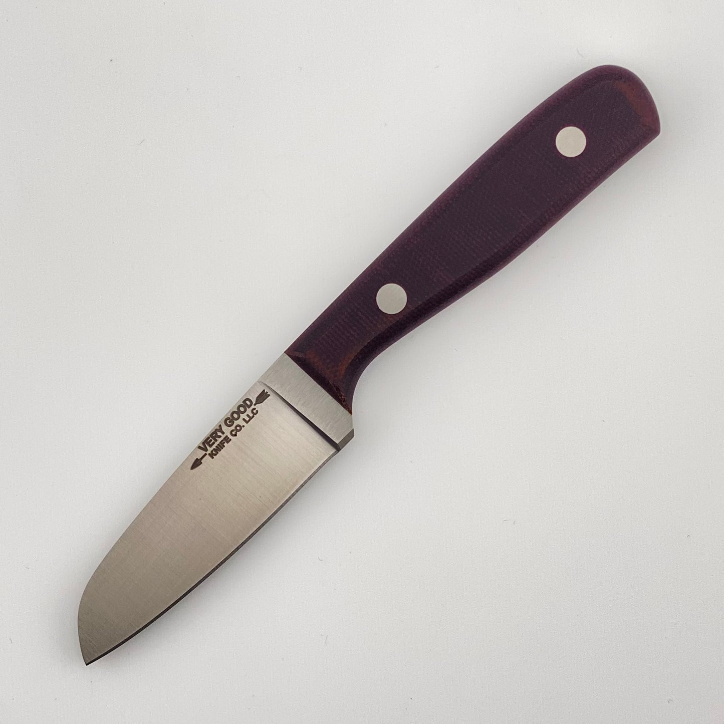 Knife with a purple handle on a white background