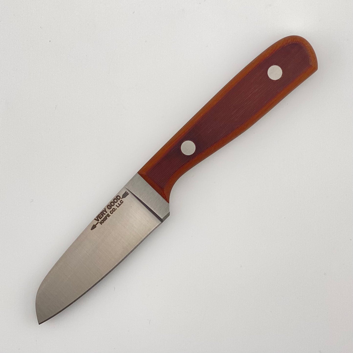 Knife with a brown vintage linen micarta handle on a white background