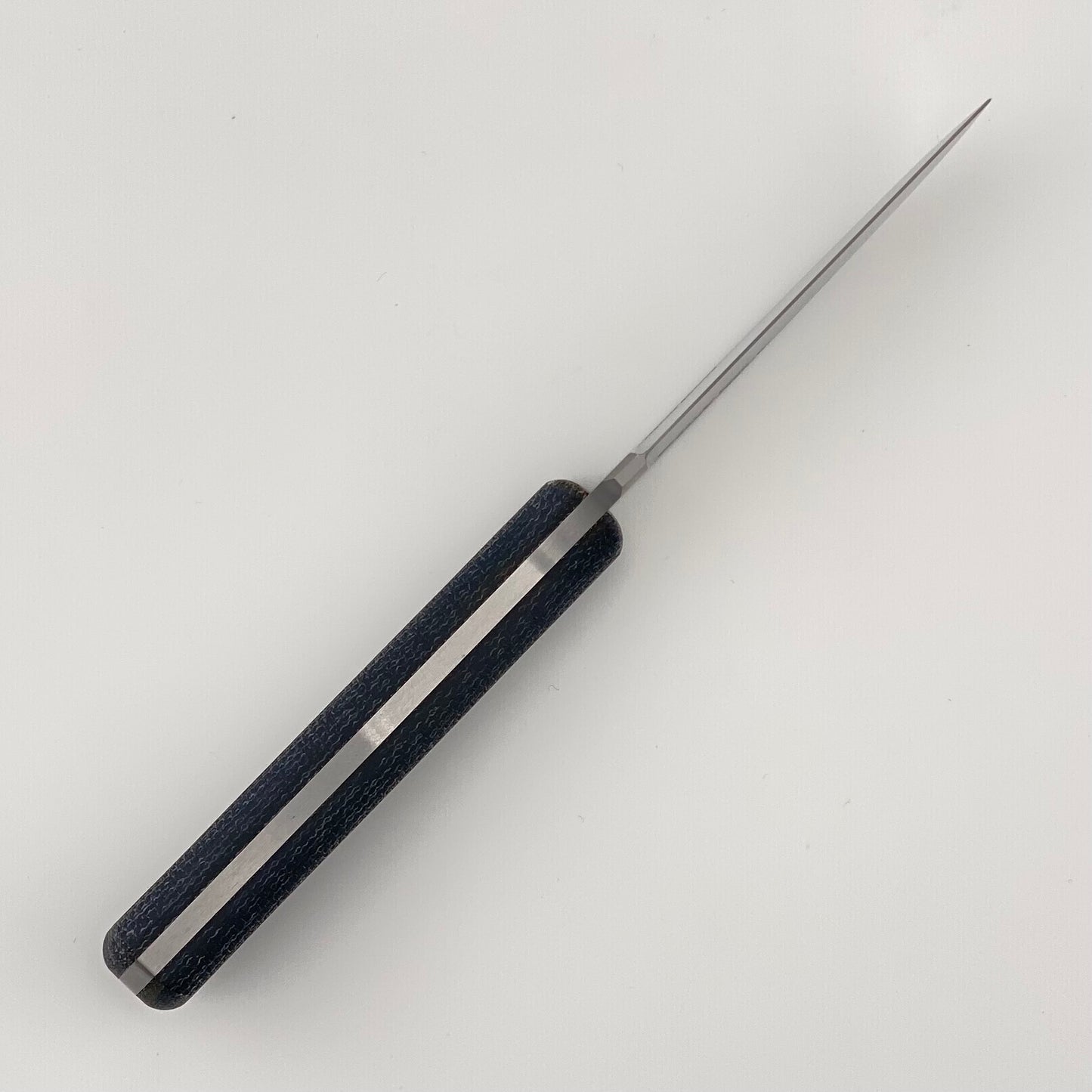 Blue handled knife on a white background