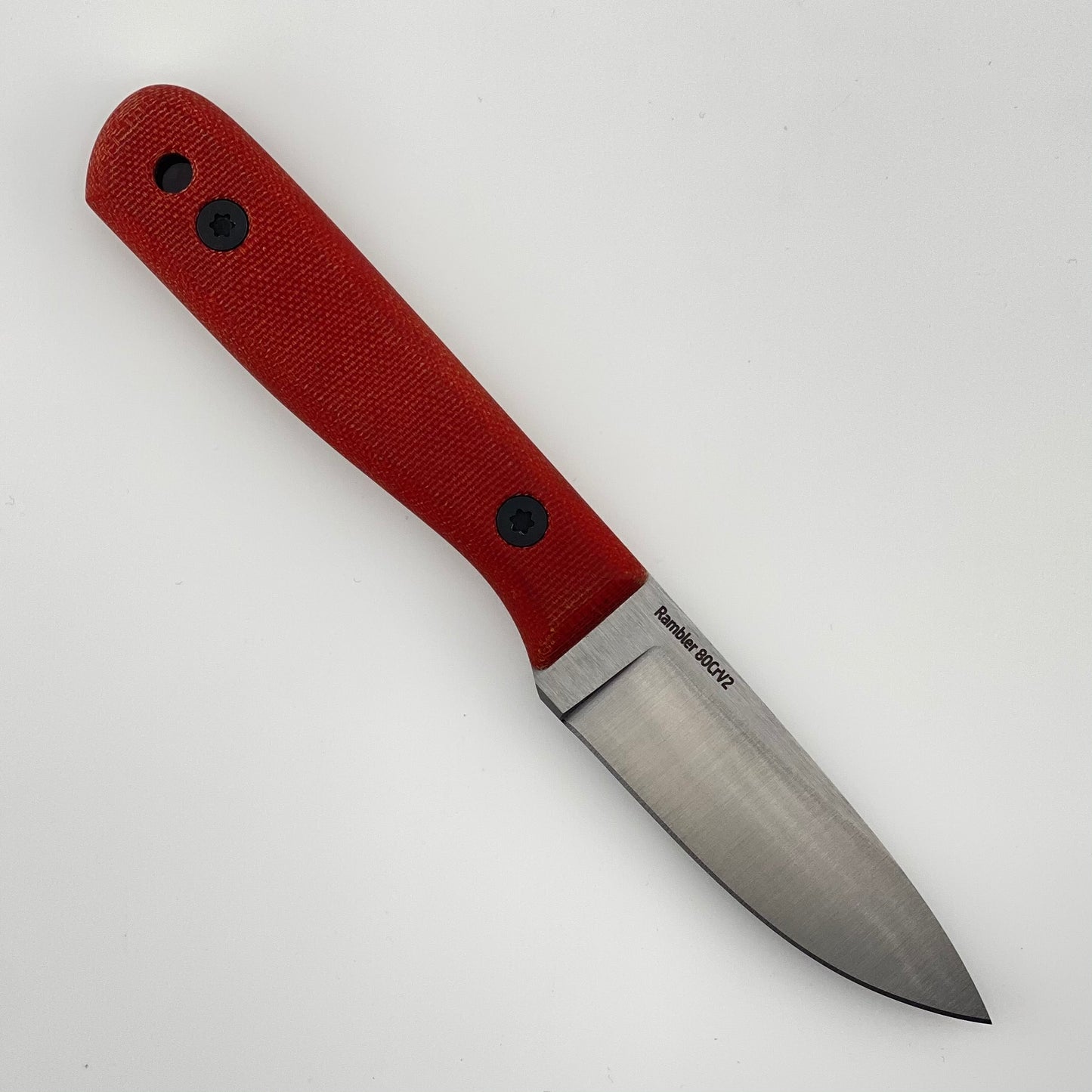 Knife with a red handle on a white background