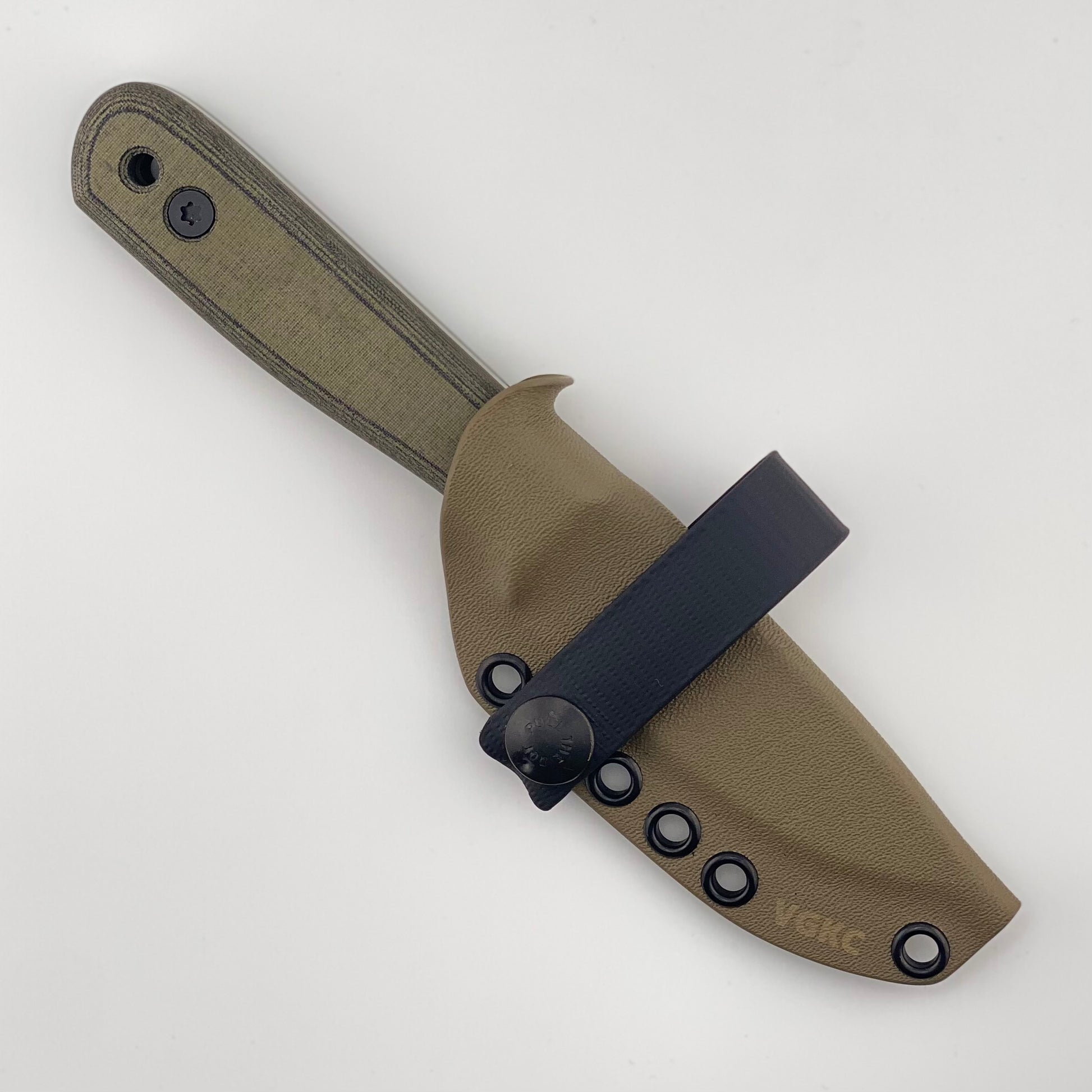 Green and black handled fixed blade knife in a tan sheath on a white background