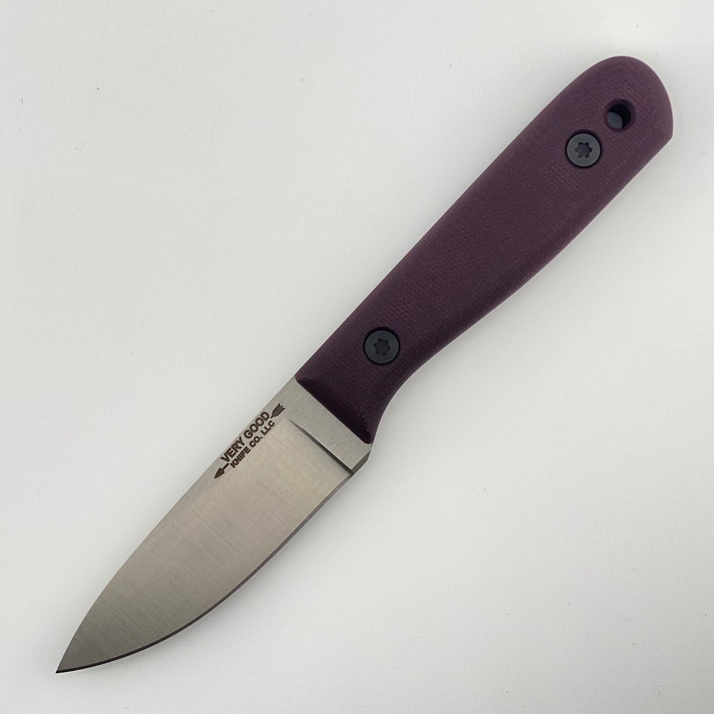 Knife with a purple handle on a white background