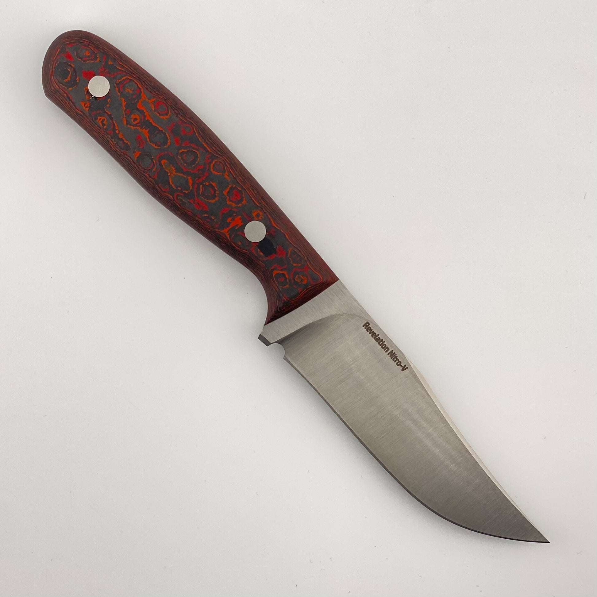 Fixed blade knife with red, orange, and black handle on a white background 