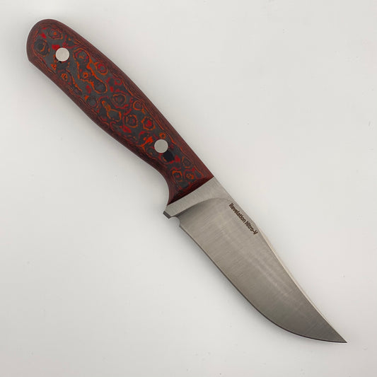 Fixed blade knife with red, orange, and black handle on a white background 