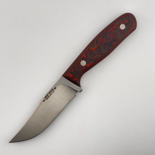 Fixed blade knife with red, orange, and black handle on a white background 