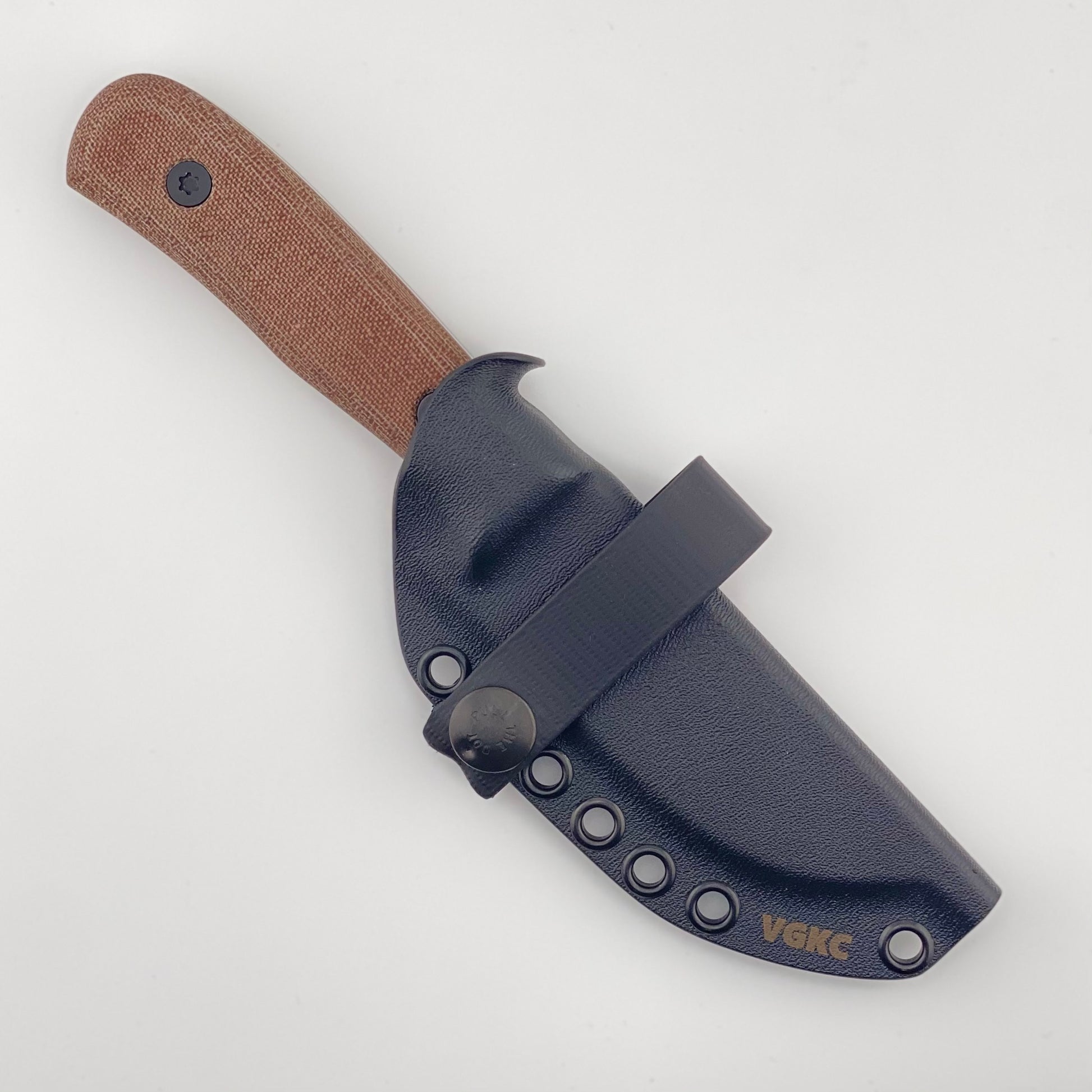 Fixed blade knife with a brown handle in a black sheath on a white background