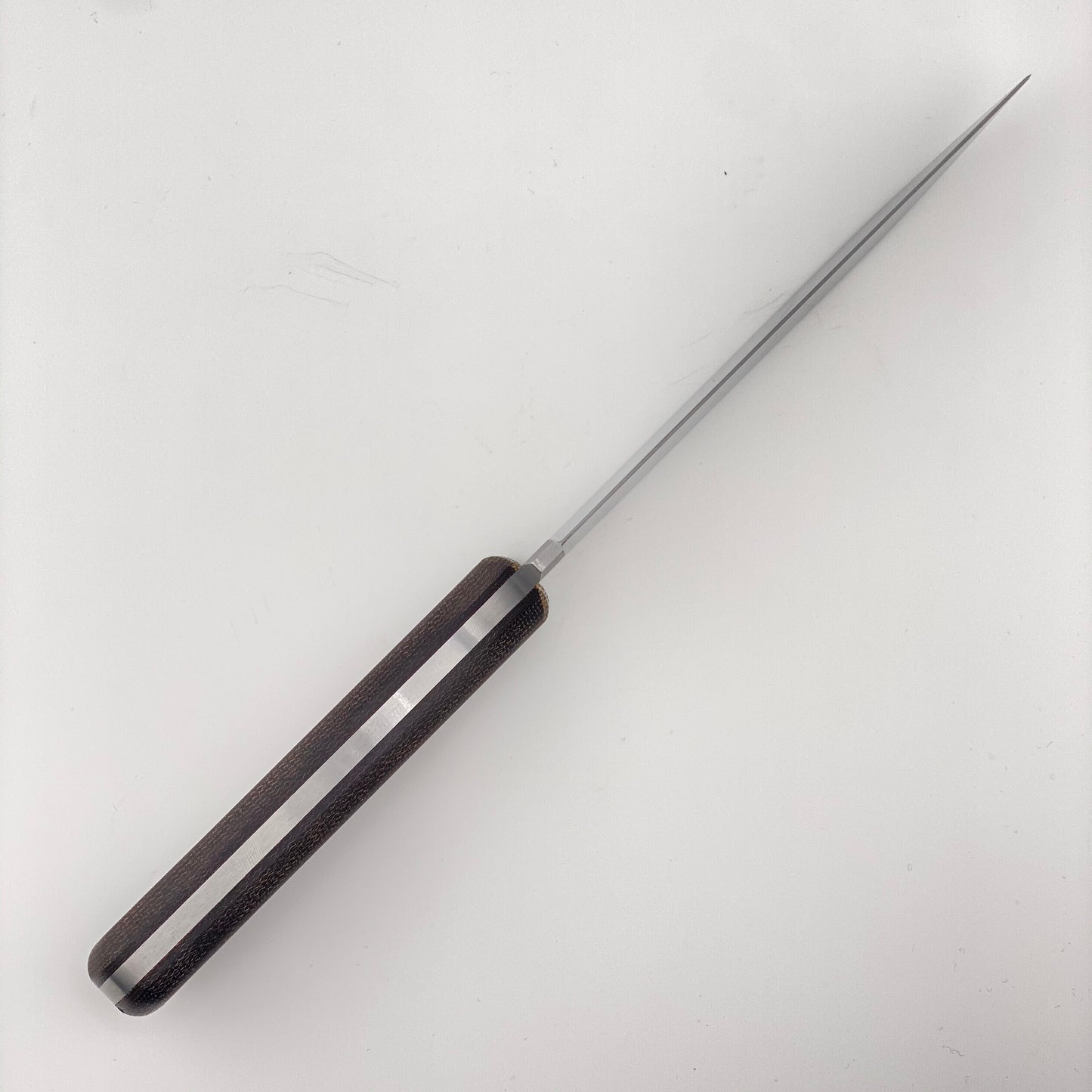 Fixed blade knife with orange and black handles on a white background