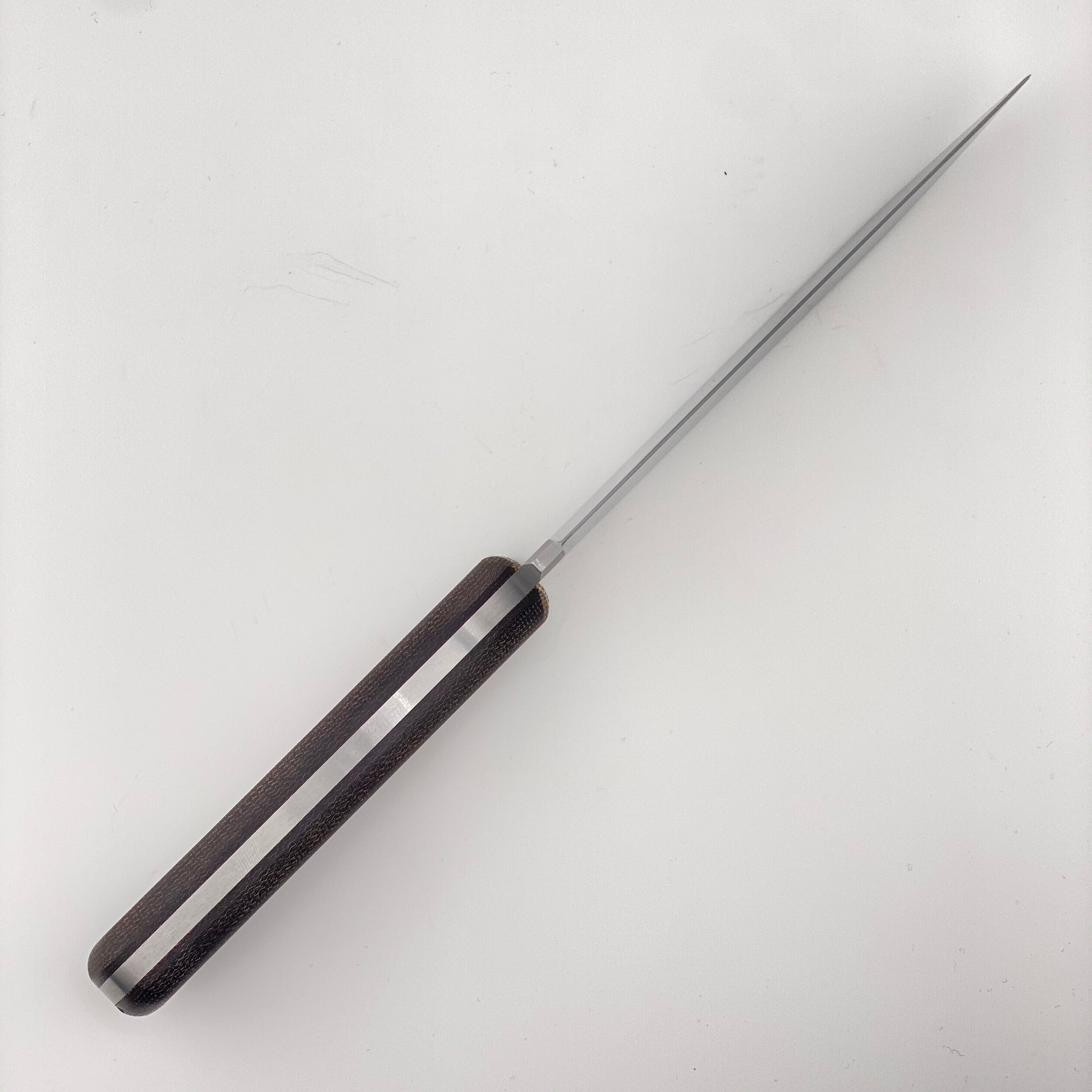 Fixed blade knife with orange and black handles on a white background