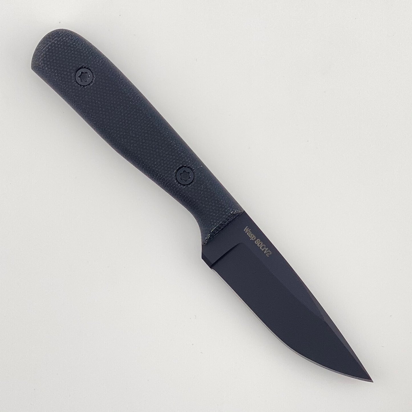 Black knife with a black textured handle on a light gray background