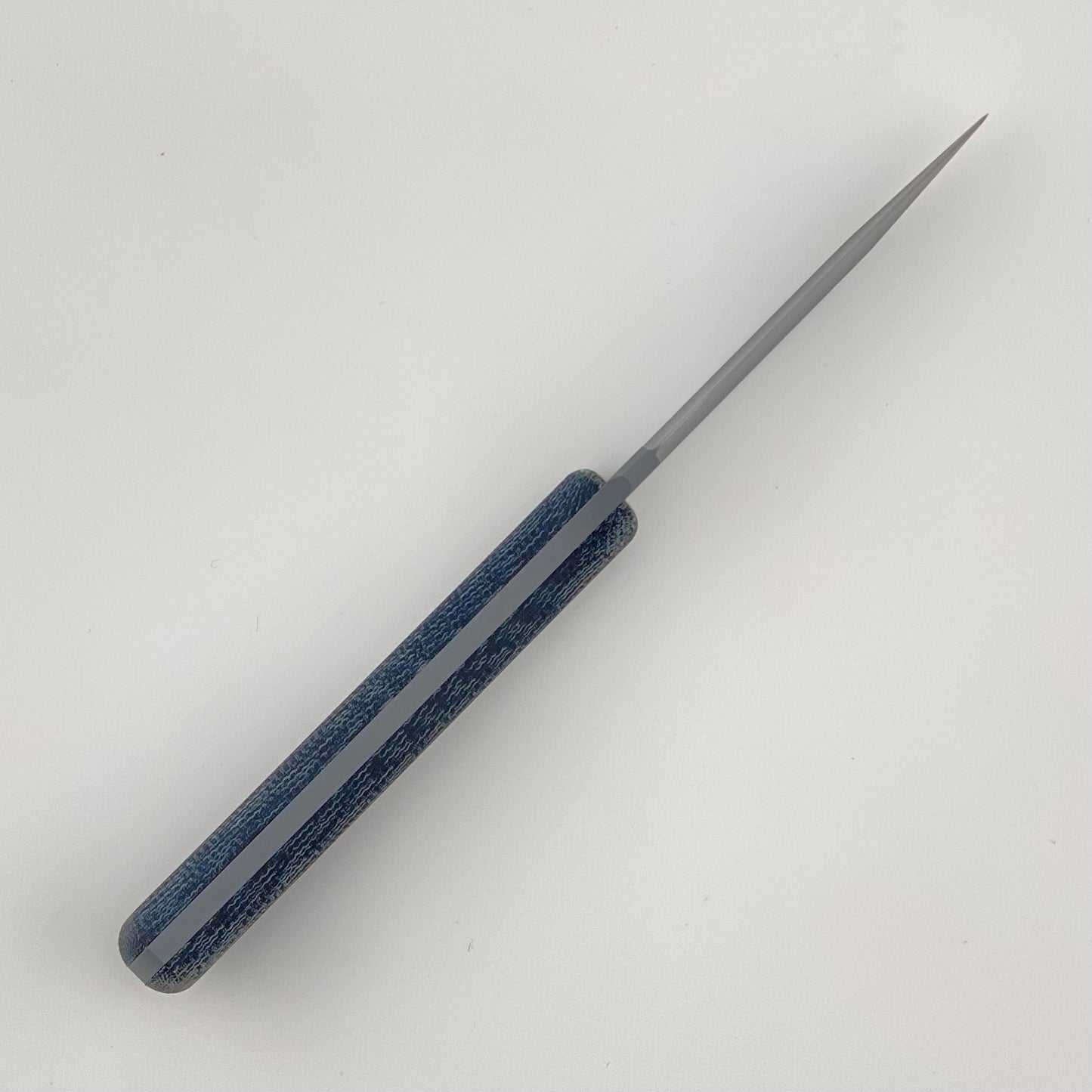 Gray fixed blade knife with denim blue handles on a white background